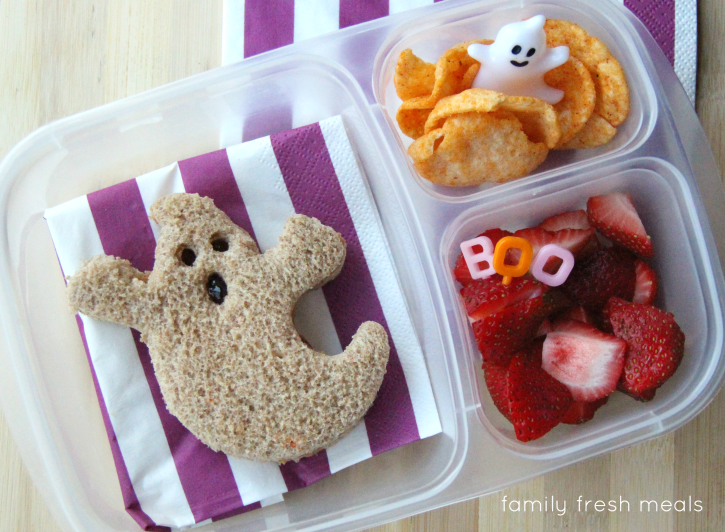 Ghost shaped sandwich, Pop Chips, and some fresh fruit. Packed in a plastic lunchbox