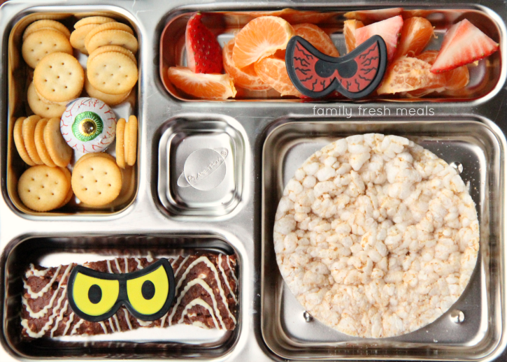 Rice cake, a mix of cheese crackers and PB crackers, fresh fruit, Cliff Bar and a chocolate eye ball. Packed in a metal lunchbox