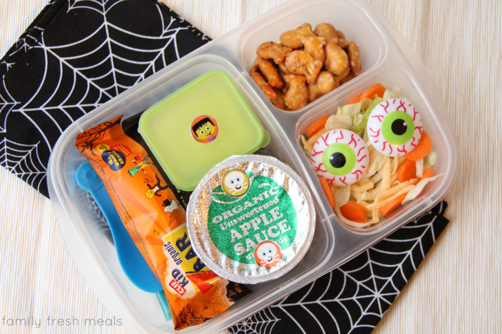 Cliff Bar, apple sauce, pretzel fish, a side salad and a mini dipper filled with salad dressing - packed in a plastic lunchbox