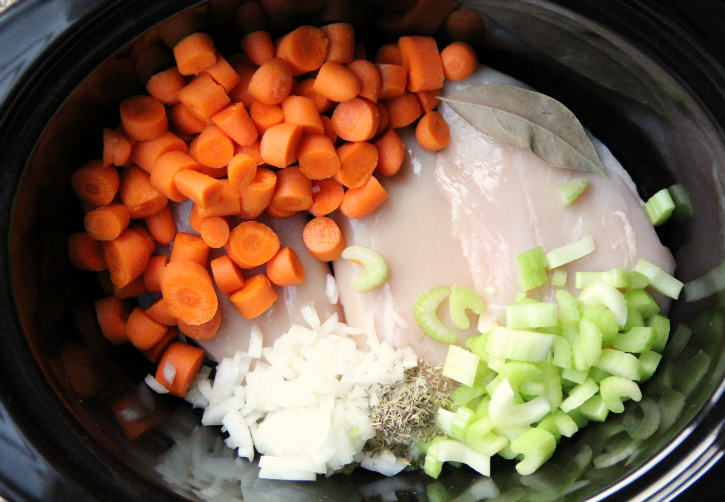 The Best Crockpot Chicken Noodle Soup - Chicken and vegetables in the crockpot