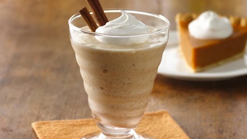  Leftover Pumpkin Pie Milkshake in a glass cup with whipped cream