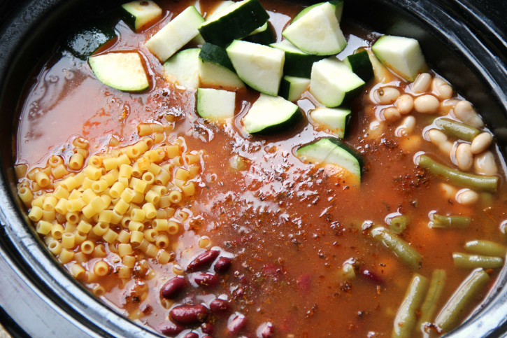 The Best Crockpot Minestrone Soup - Add in noodles, beans and zucchini to slow cooker