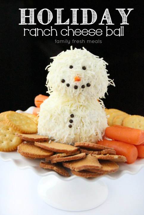 Holiday Ranch Cheese Ball on a plater surrounded by crackers and carrots