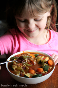 Child eating Crockpot Minestrone Soup