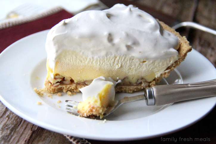 Piece of Triple-Layer Eggnog Pie on a plate with a fork