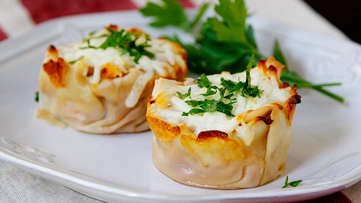 Two Turkey Lasagna Cups on a white plate