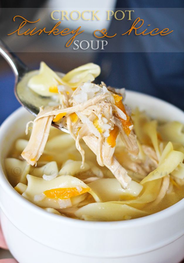 Crockpot Turkey Rice Soup being scooped up with a spoon