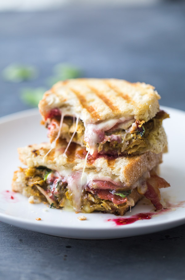 thanksgiving turkey panini cut in half and on a plate