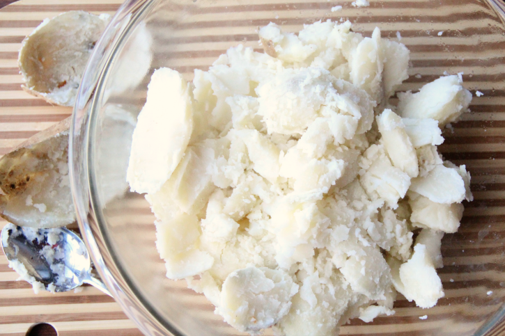 potatoes souped out and in glass mixing bowl