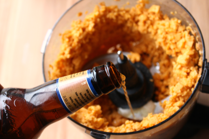 Pub Style Beer Cheese Dip - Pour beer into cheese mix