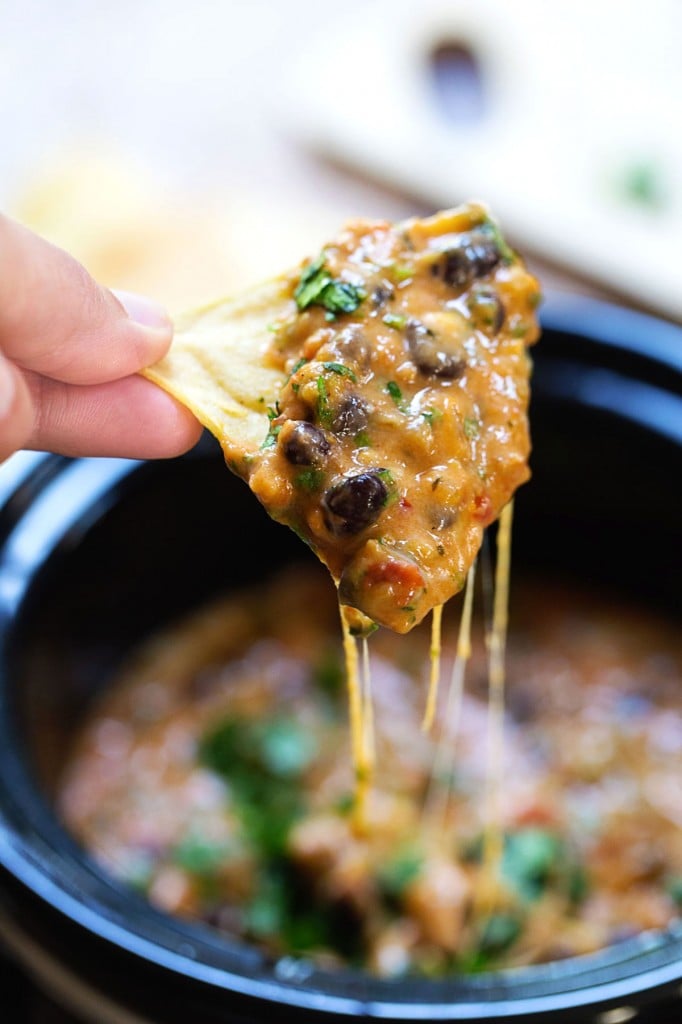 30 Easy Appetizers People LOVE - HOMEMADE CHEESY CHILI DIP being scooped up with a chip