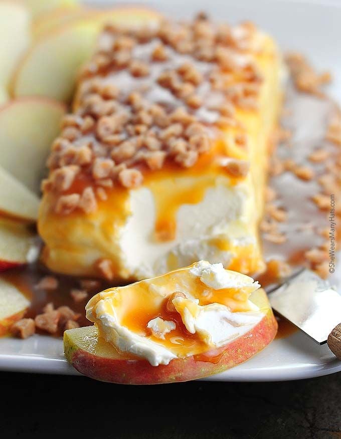  30 Easy Appetizers People LOVE - CARAMEL APPLE CREAM CHEESE SPREAD served on a plate with apple slices