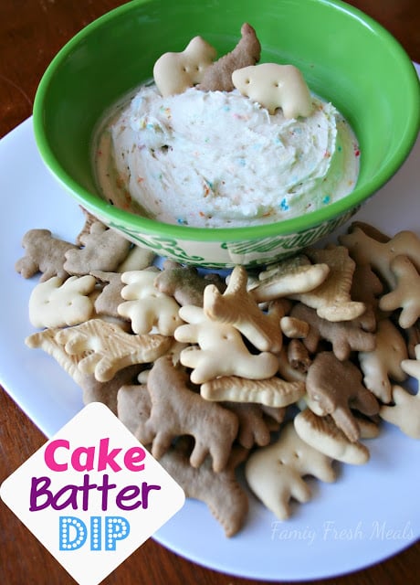 Cake Batter Dip in a green bowl, surrounded by animal cracker cookies