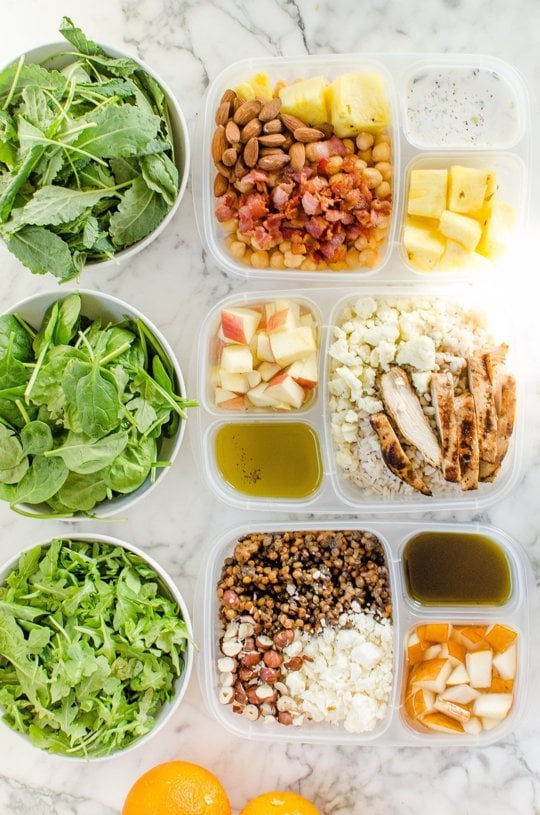 3 different salad packed in plastic lunchboxes