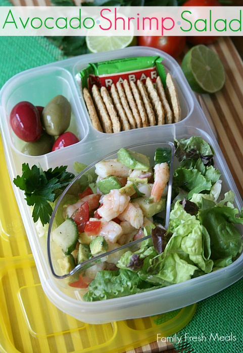 Avocado Shrimp Salad packed in a lunchbox with olives, lettuce and crackers