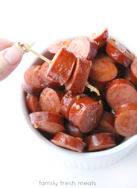 Crockpot Honey Garlic Polish Sausage  in a bowl with a food pick