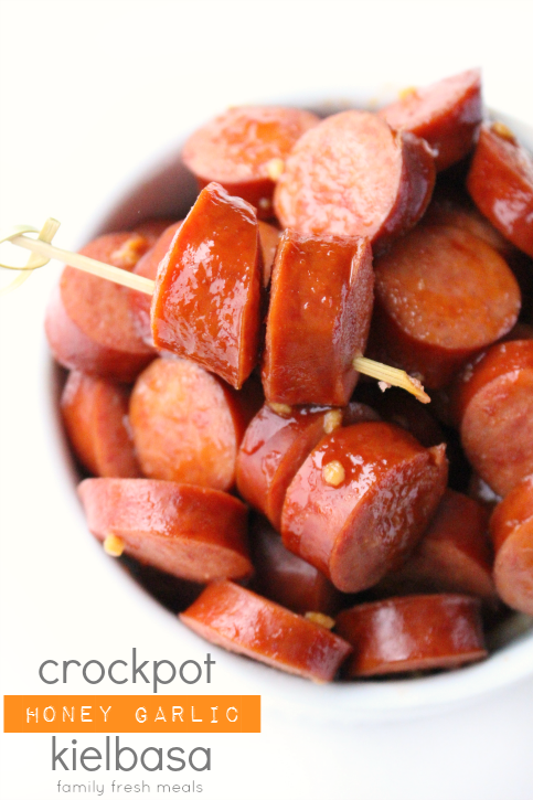 Crockpot Honey Garlic Polish Sausage in a  bowl with a food pick