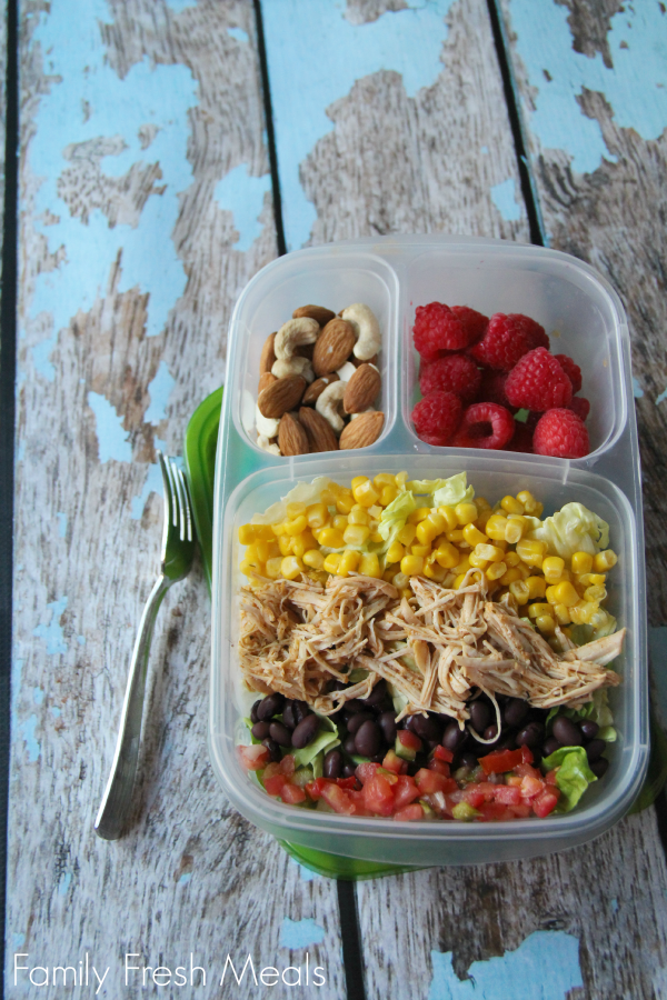Cool ranch chicken packed as a salad, with a side of fruit and nuts - in a lunch box