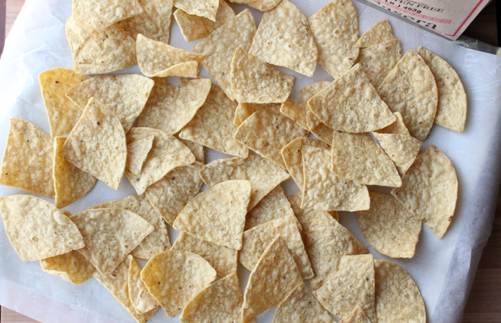 tortilla chips on a baking sheet