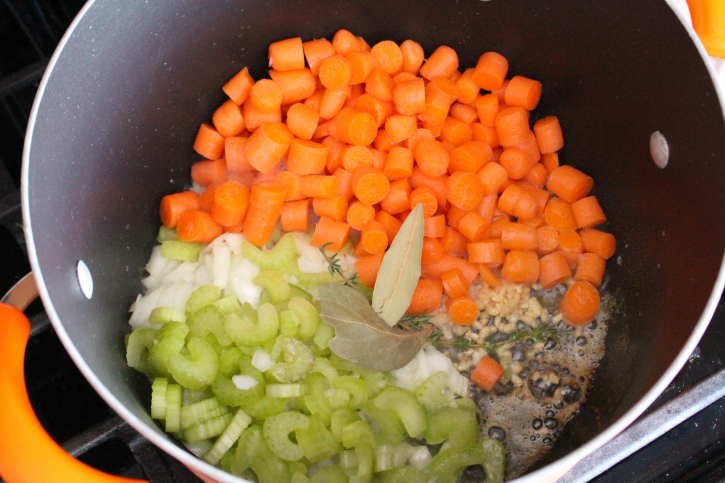 onion, garlic,  celery, carrots, bay leaves, thyme, salt and pepper in a large soup pot