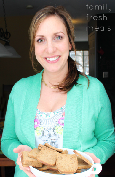 Woman holding a platter of small toasts