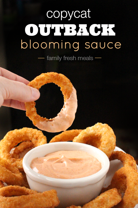 Copycat Outback Blooming Sauce in a small dish with onion rings