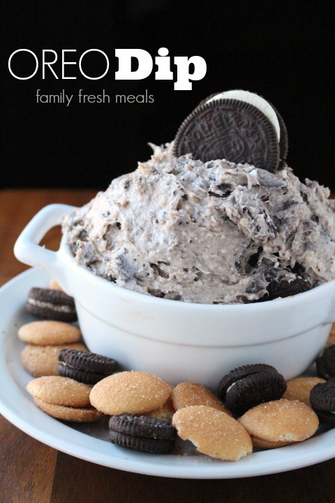 Creamy Oreo Dip Dessert in a white bowl, surrounded by cookies