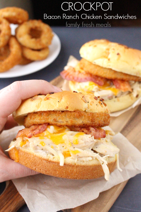 Hand holding a Crockpot Bacon Ranch Chicken Sandwich