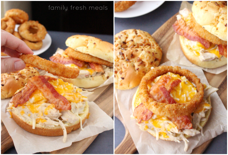 Placing an onion ring on open faced chicken sandwich