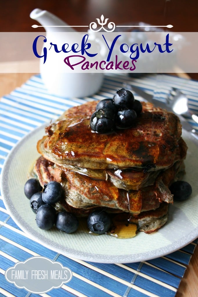 Greek Yogurt Pancakes stacked on a plate with blueberries