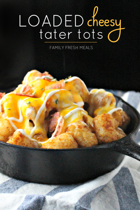 Loaded Cheesy Tater Tots in a cast iron skillet