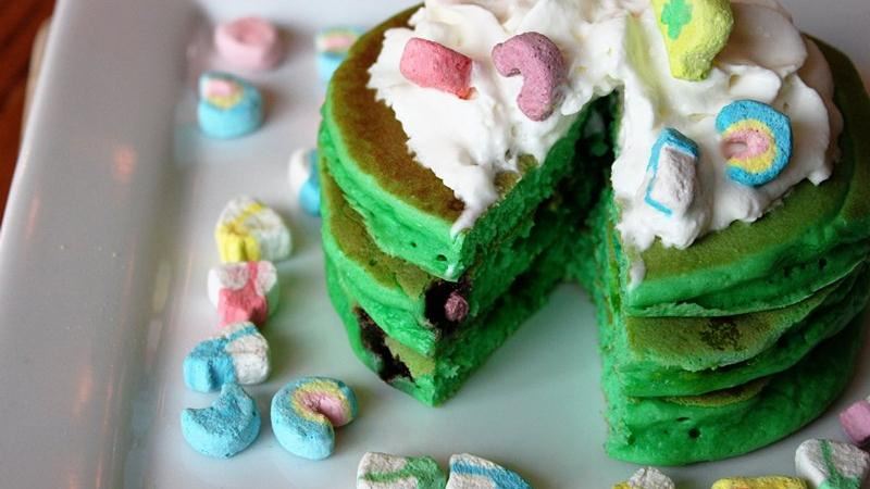 Green Lucky Charms pancakes on a white plate