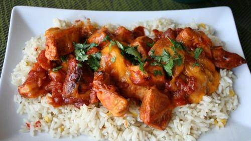 Slow Cooker Cheesy Mexican Chicken served over rice