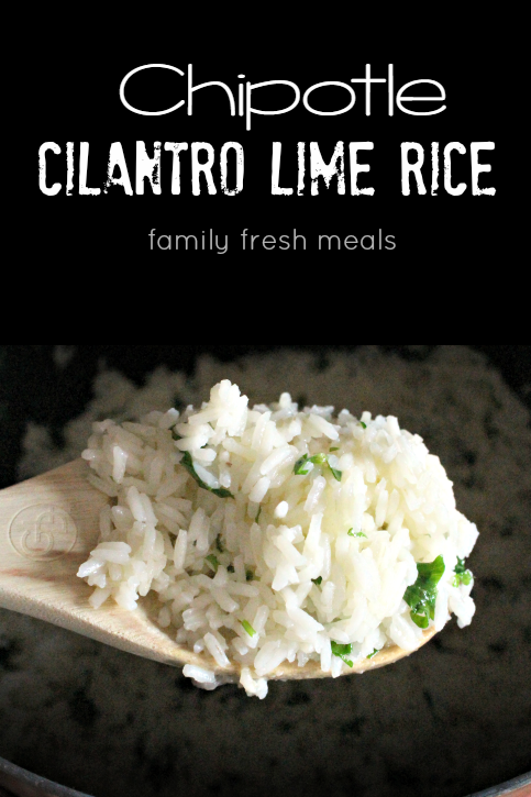 Wooden spoon scooping up Copycat Chipotle Cilantro Lime Rice 