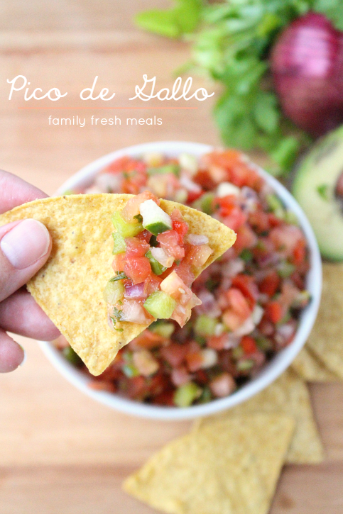 Pico de Gallo Fresh Salsa Recipe being scooped up with a tortilla chip