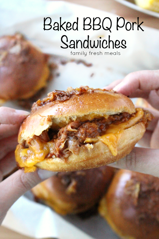 hands holding a Baked BBQ Pulled Pork Sandwich