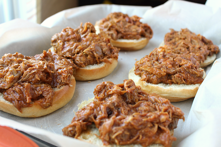 Open faced Baked BBQ Pork Sandwiches on a baking sheet