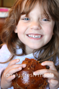 Child holding a Baked BBQ Pork Sandwiches