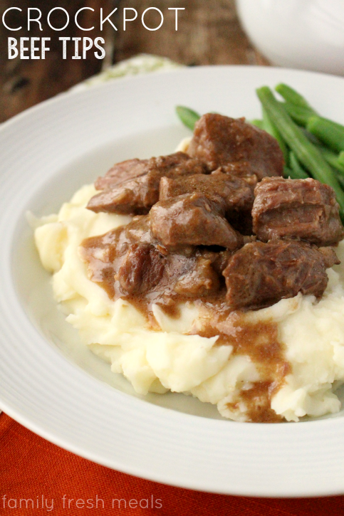 Easy Crockpot Beef Tips and Gravy served over mashed potatoes