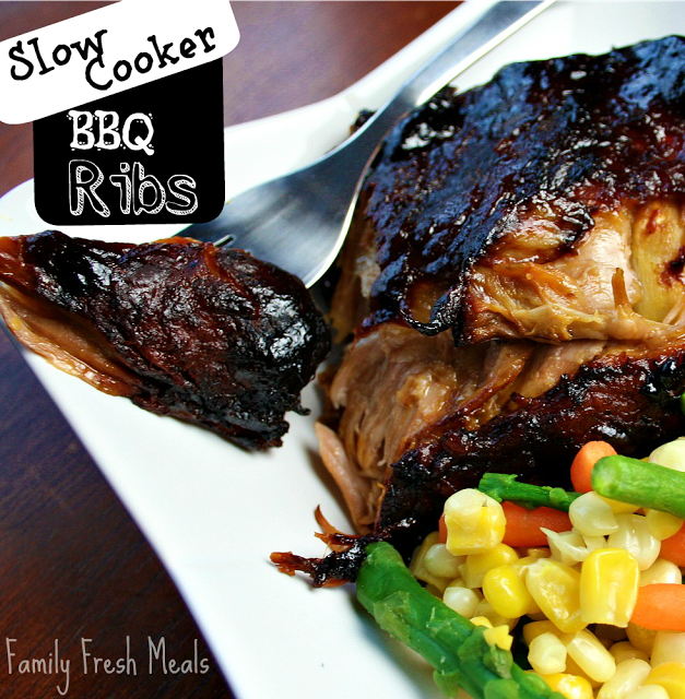 Slow Cooker BBQ Ribs on a white plate with veggies