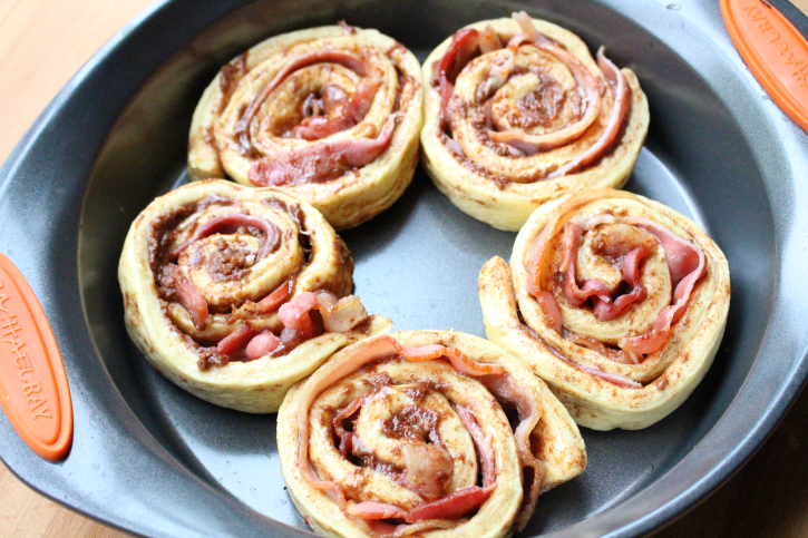 Five Bacon Wrapped Cinnamon Rolls in a baking dish
