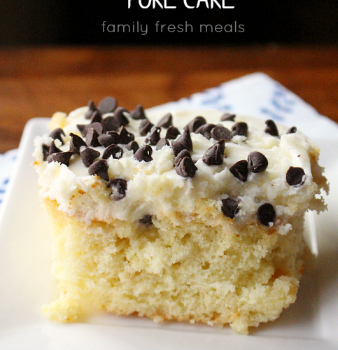 Piece of Cannoli Poke Cake Enjoy on a white plate