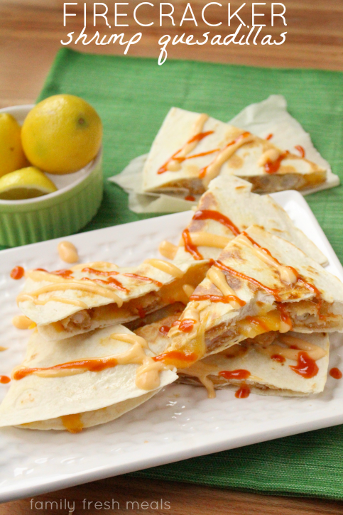 Firecracker Shrimp Quesadillas stacked on a white plate