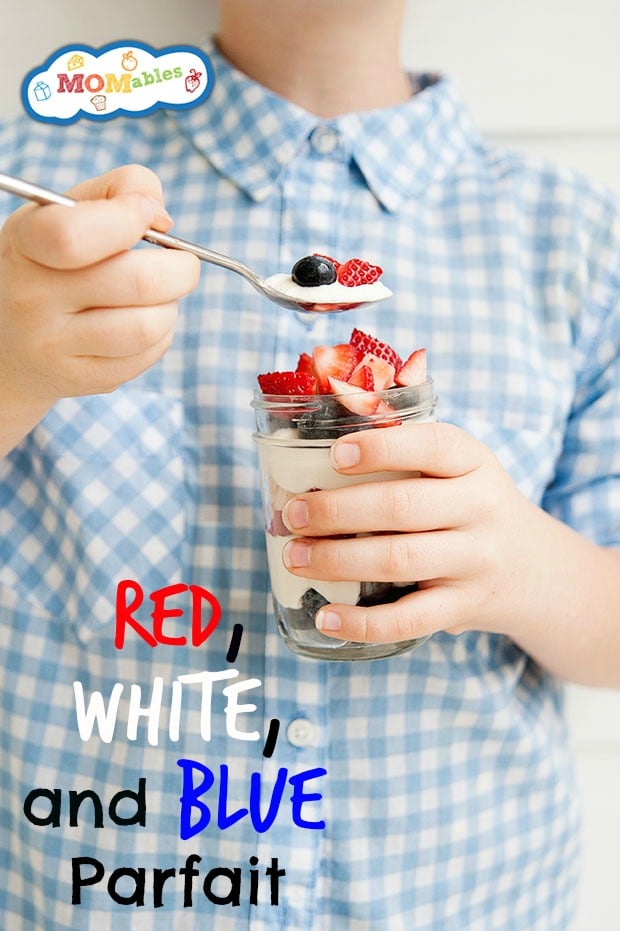 Child holding a Red, White and Blue fruit parfait