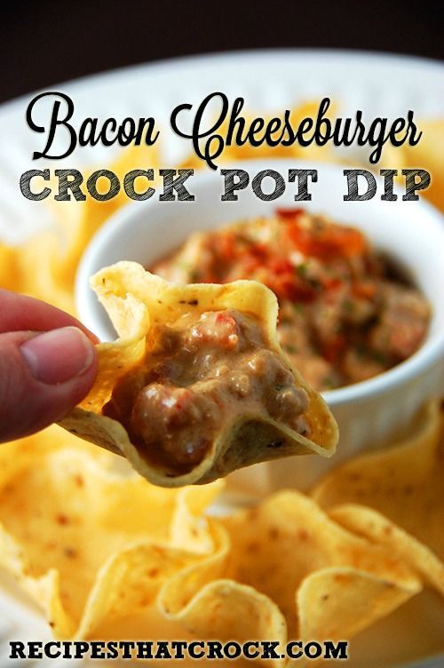 Bacon Cheeseburger Crockpot Dip with a tortillas chip scooping up some