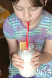 child drinking an Apple Pie Smoothie 