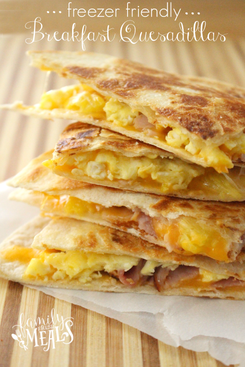 stack of breakfast quesadillas on a cutting board