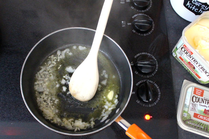 One Pot Cheesy Zucchini Rice - Saute onion in butter