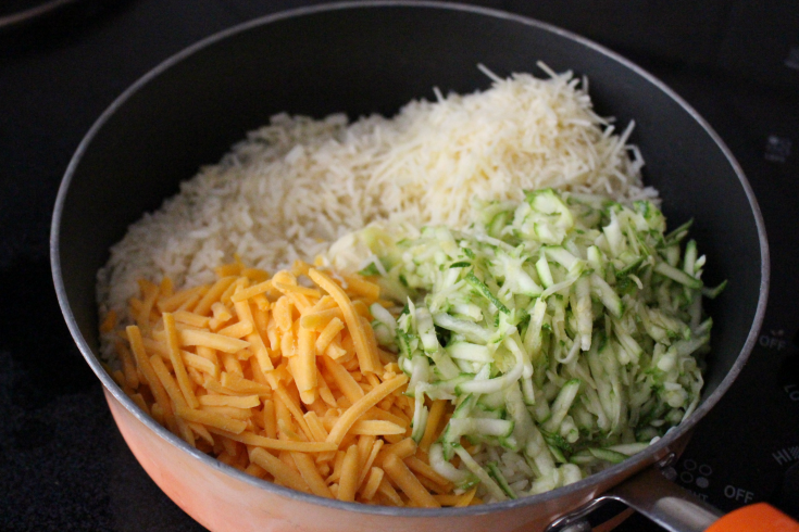 Stir in cheese and shredded zucchini 