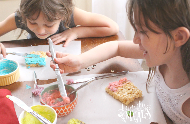 Two children making Halloween Monster Rice Krispies Treats